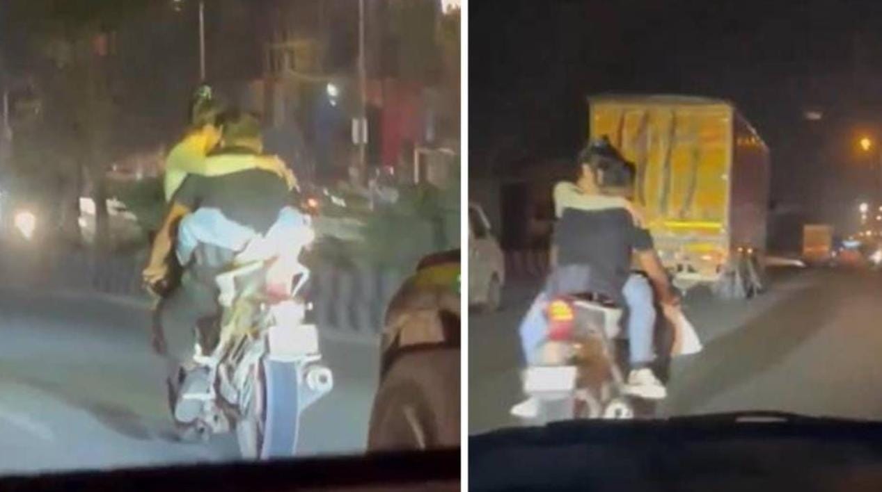 Video: बाइक पर रोमांस करते नजर आये कपल, लोग बोले- ना तो कानून का डर और न ही जिंदगी प्यारी इन्हें तो बस रोमांस करने की है बीमारी